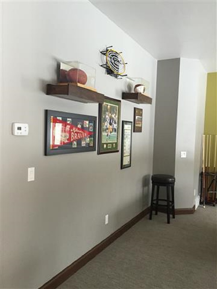 sports-themed wall with memorabilia