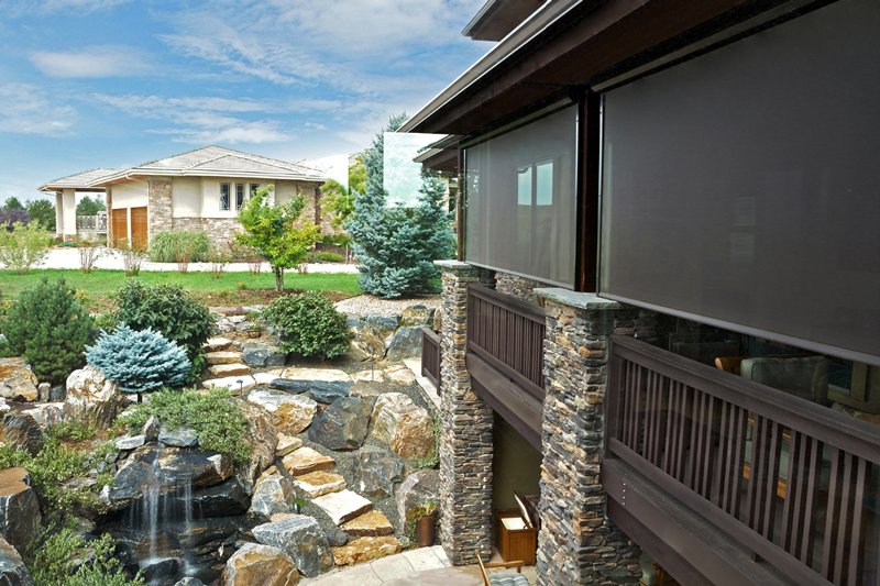 black exterior beside a garden